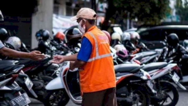 Ilustrasi juru parkir.